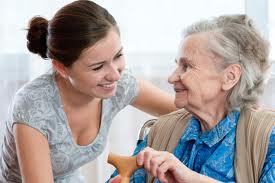 smiles between a young adult and elderly